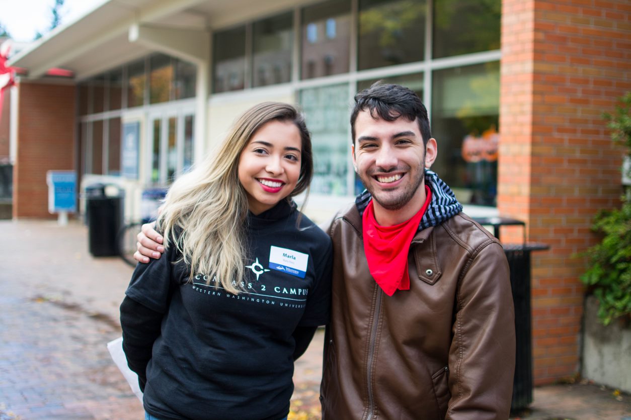 Two student employees, smiling together.