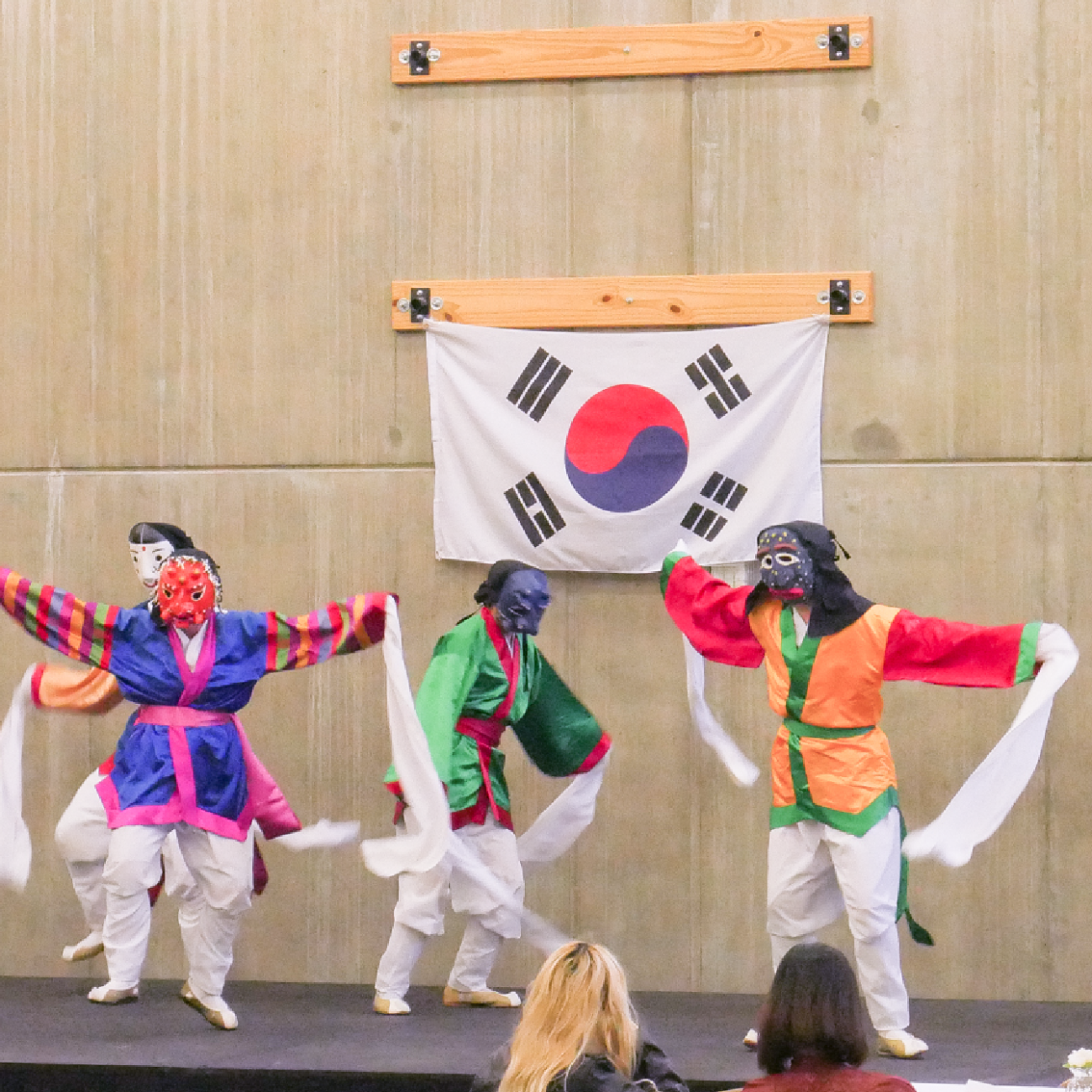 Three dancers performing a traditional dance for Korean Student Association's heritage dinner